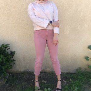 pink skinny jeans with detailing at cuff